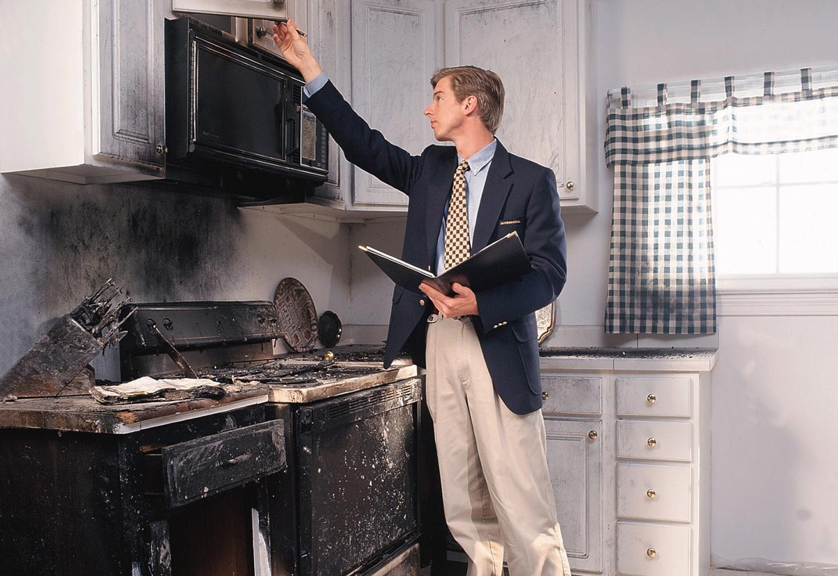 Public Adjuster inspecting kitchen fire damage